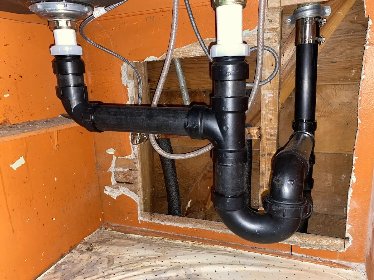 Professional Garbage Disposal Repair equipment and tools on the job in Stanford